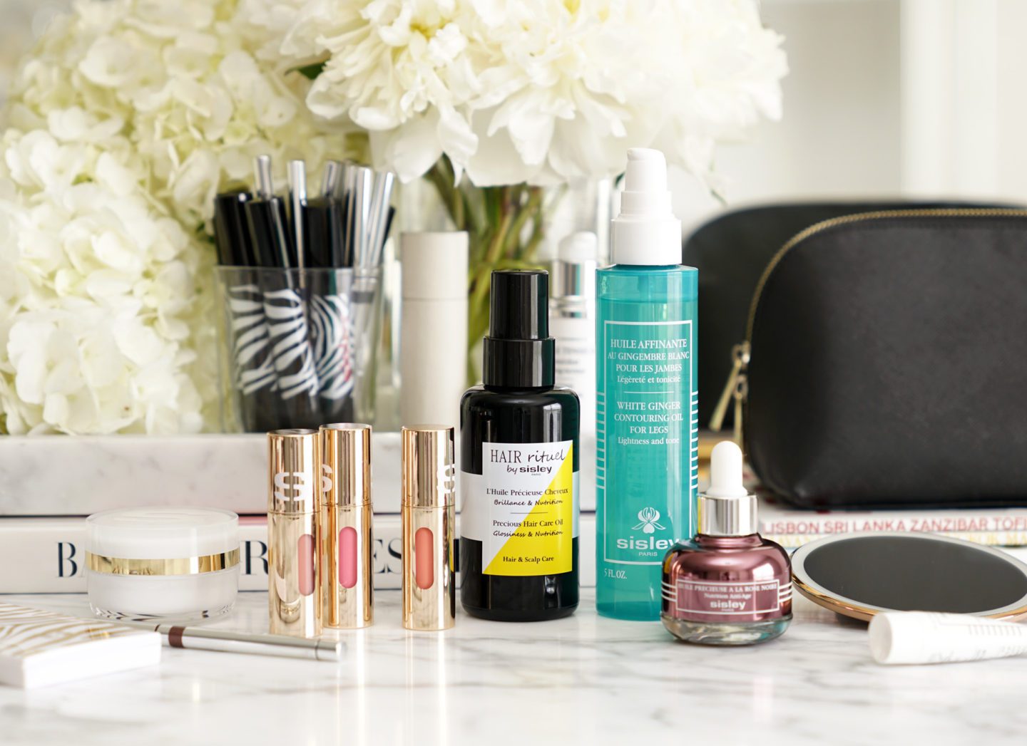 Sisley Review of the Phyto-Lip Delight, Hair Rituel Precious Hair Oil, Black Rose Precious Face Oil and White Ginger Contouring Oil for legs