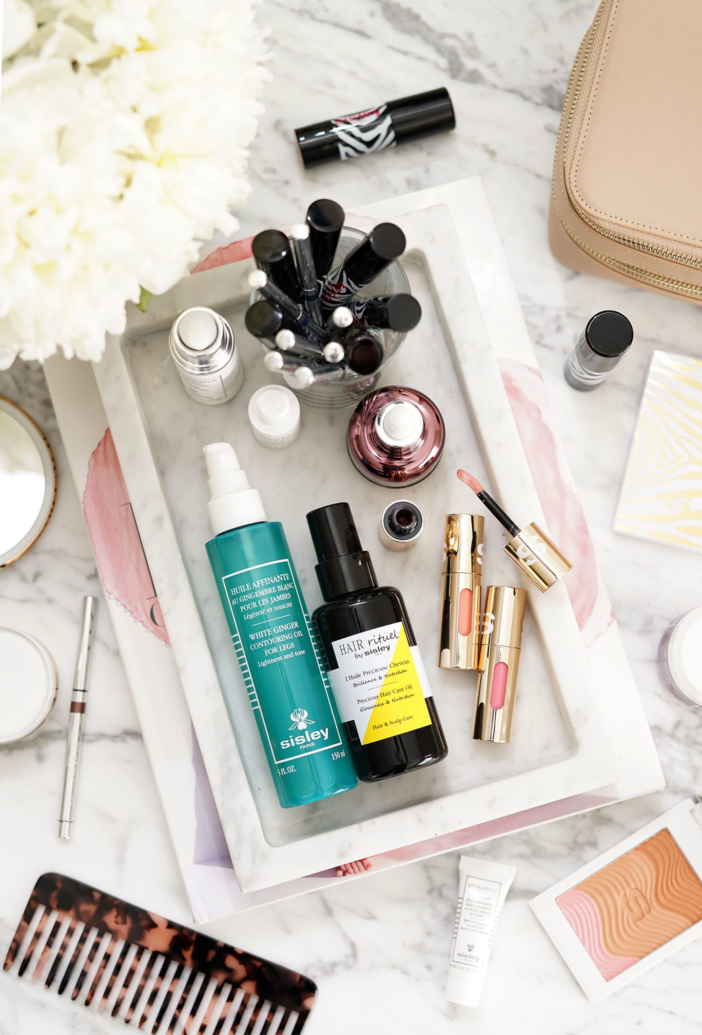 Luxury Skincare Review of the Sisley Phyto-Lip Delight, Hair Rituel Precious Hair Oil, Black Rose Precious Face Oil and White Ginger Contouring Oil for Legs