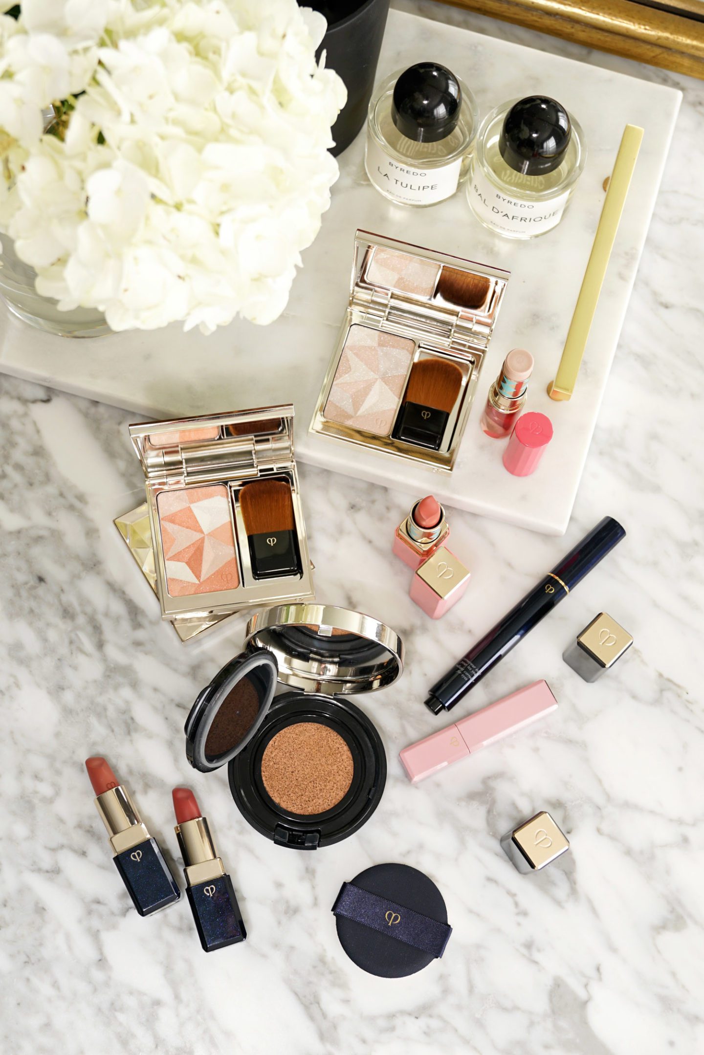 Cle de Peau Haul Radiant Cushion Foundation, Luminizing Face Enhancer, Highlighting Stick and more | Fashion Groom Spot