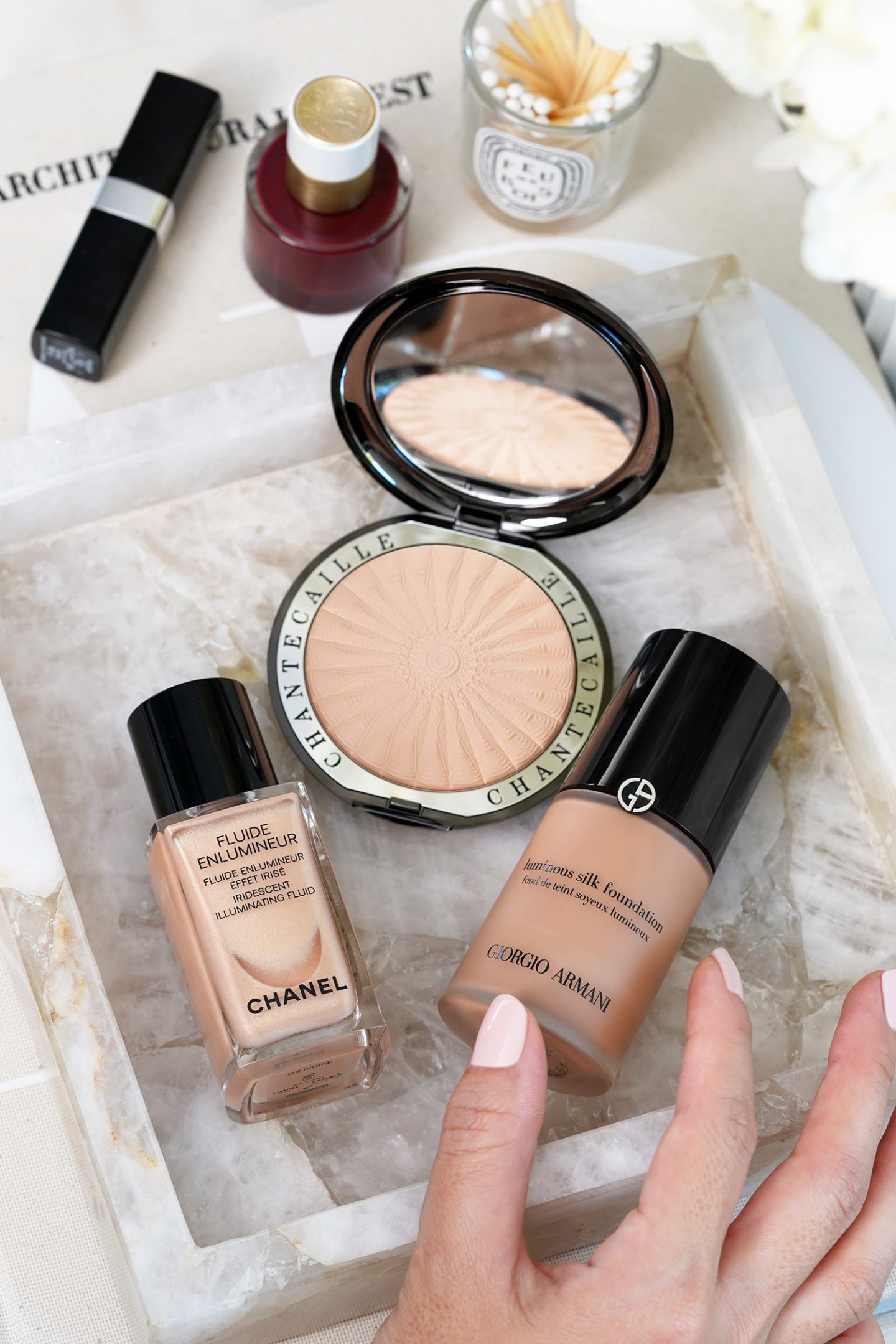 Chanel’s Fluide Enlumineur Or Ivoire Highlighter, Chantecaille Perfect Blur Powder, Armani Luminous Silk Foundation