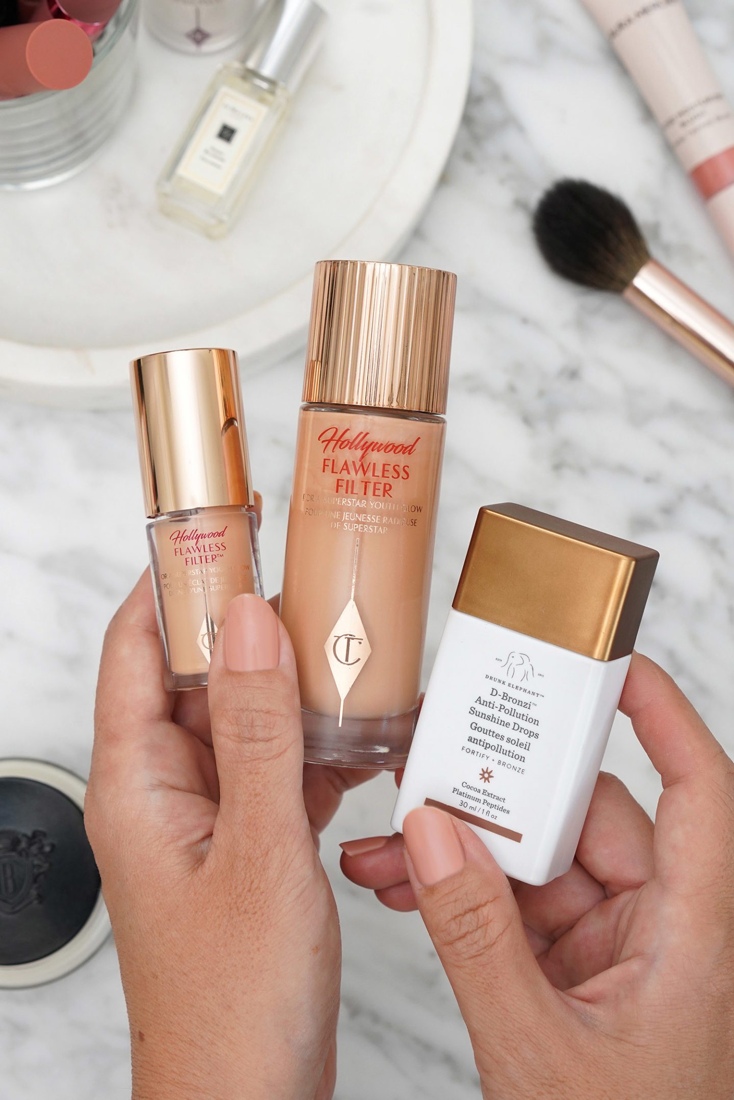 Drunk Elephant D-Bronzi Anti-Pollution Bronzing Drops and Charlotte Tilbury Hollywood Flawless Filter