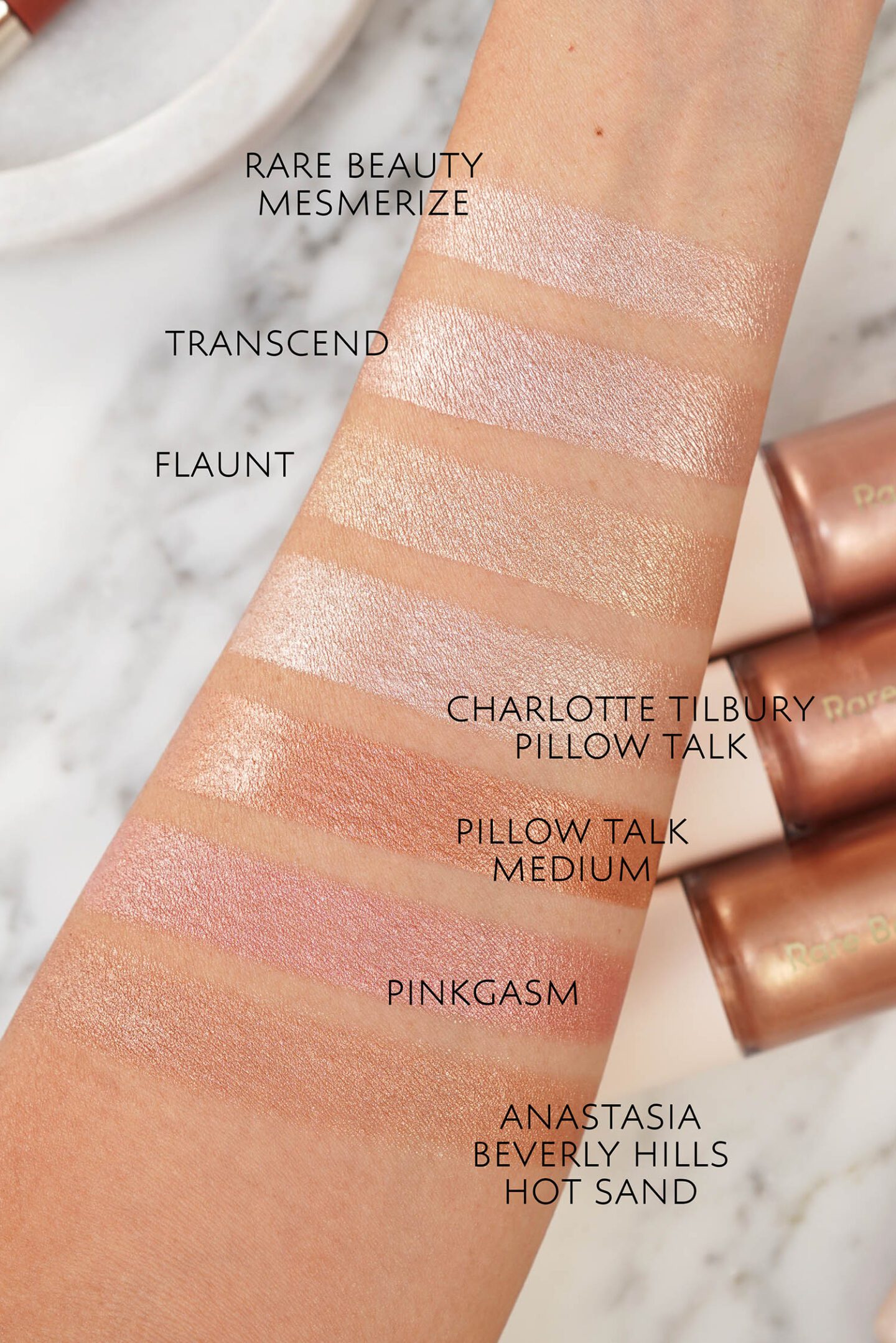 Rare Beauty Positive Light Liquid Luminizers swatches vs Charlotte Tilbury Beauty Light Wands